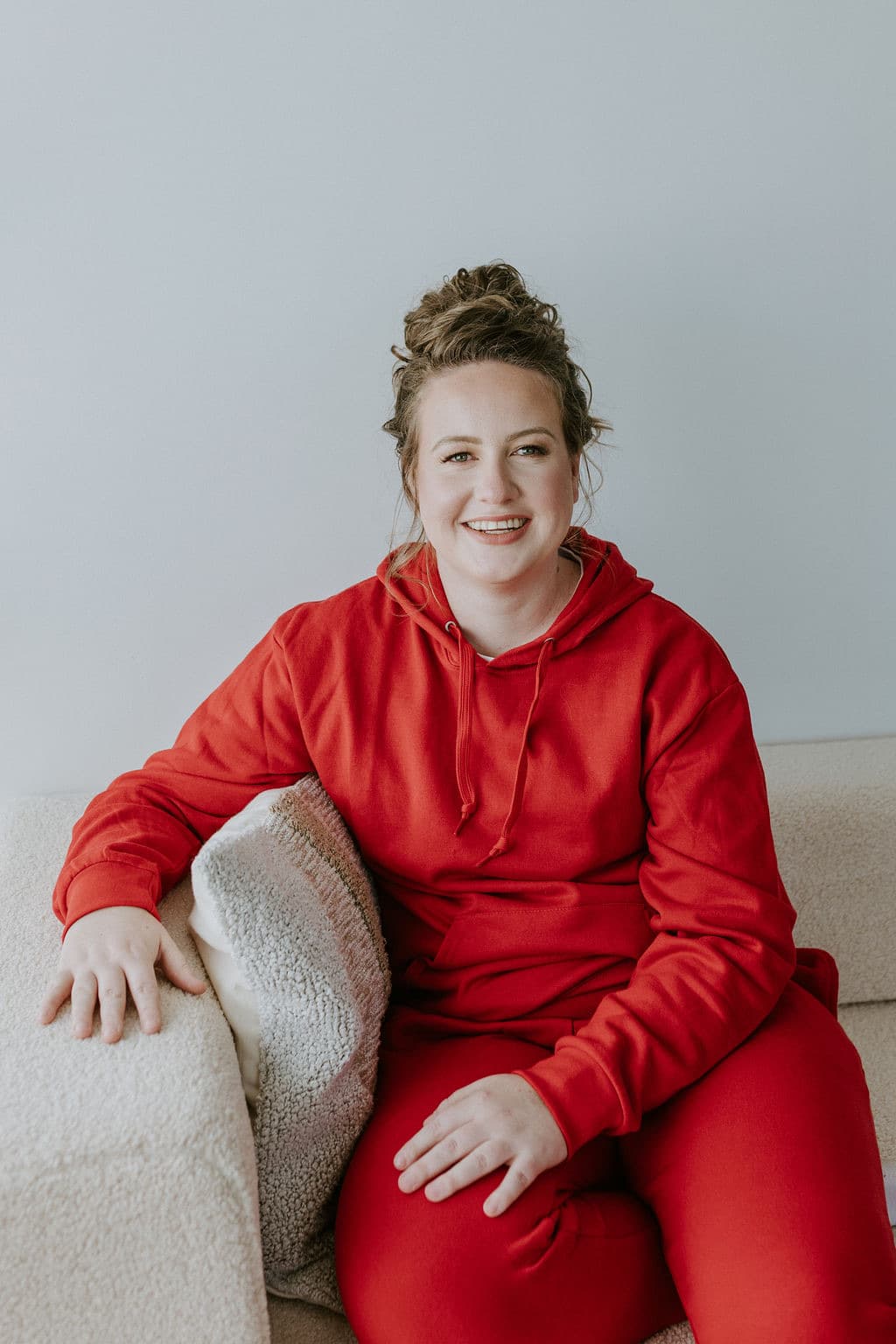 Megan Nakazawa relaxing on a couch at home
